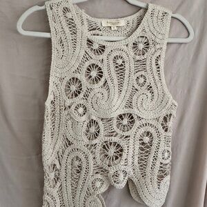 Asymmetrical cream sleeveless top